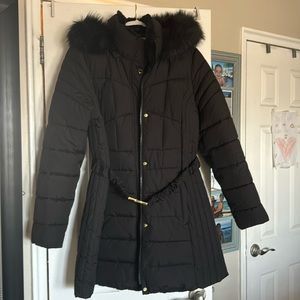 Black puffer coat with gold belt